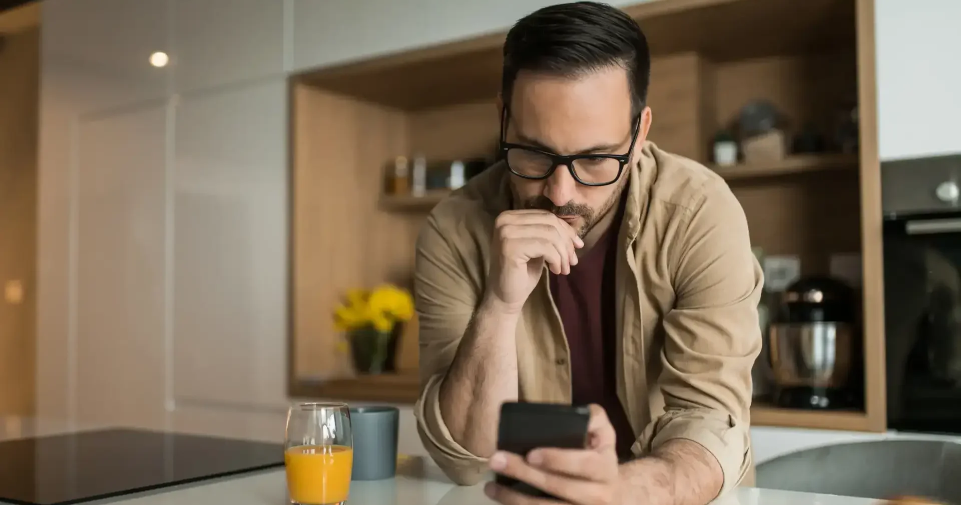 A man looking for an attorney on his phone.